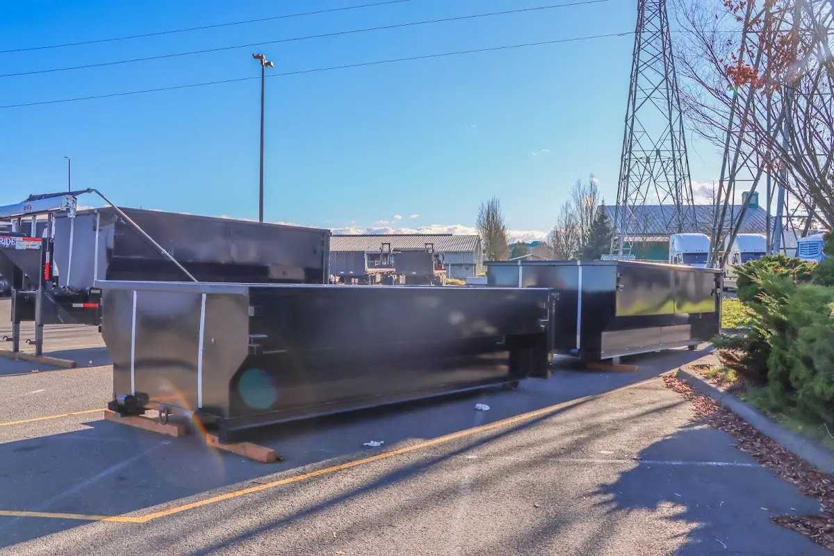 Roll-off dumpster ready for waste disposal at job site for Concrete Dumpster Rental in Greendale